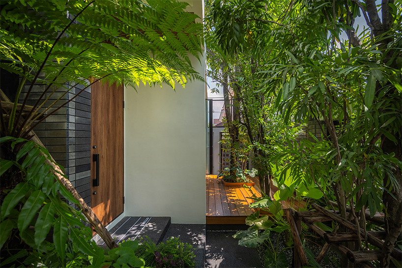 seven interconnected courtyards weave greenery into studio bewell's house in bangkok