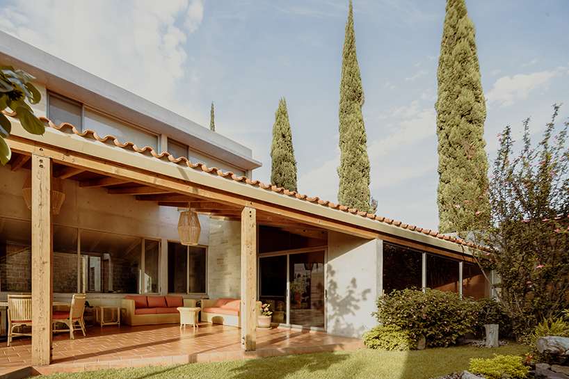 shielded portico encircles residence's square volumes in mexico