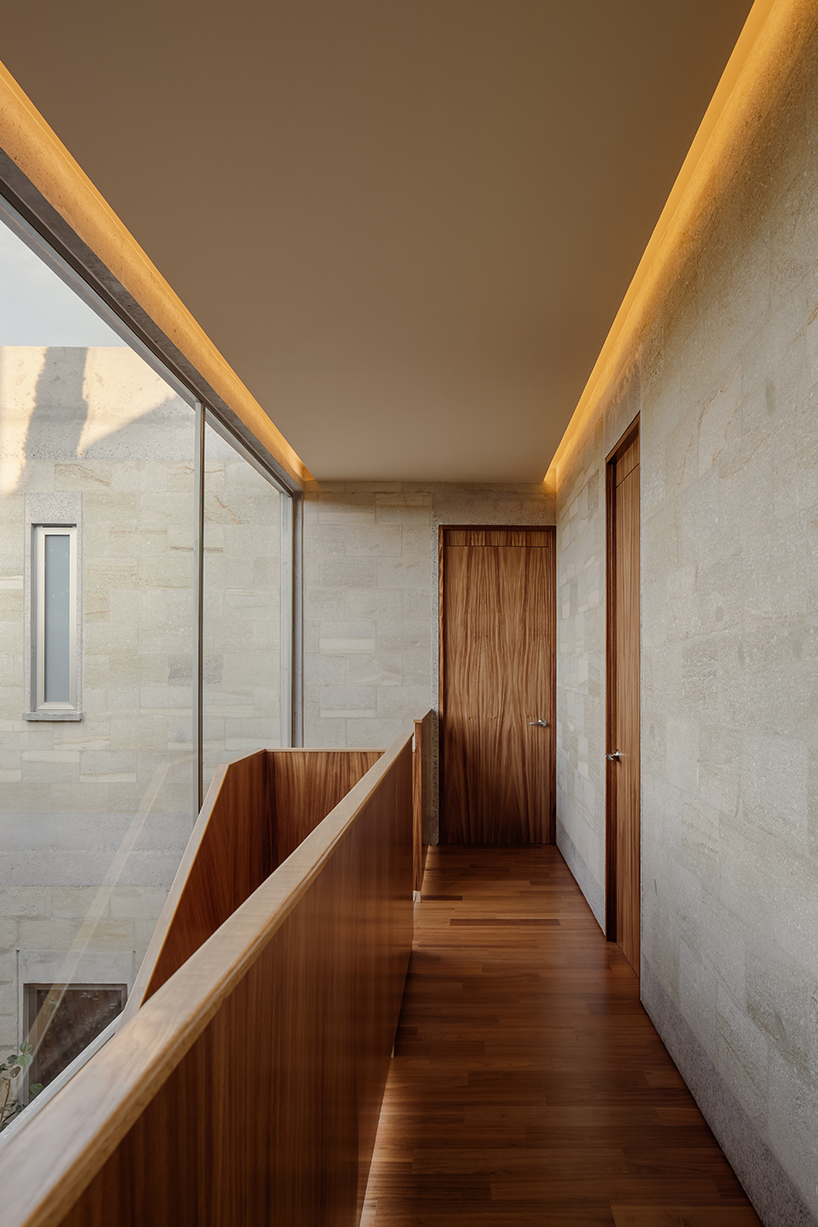 shielded portico encircles residence's square volumes in mexico