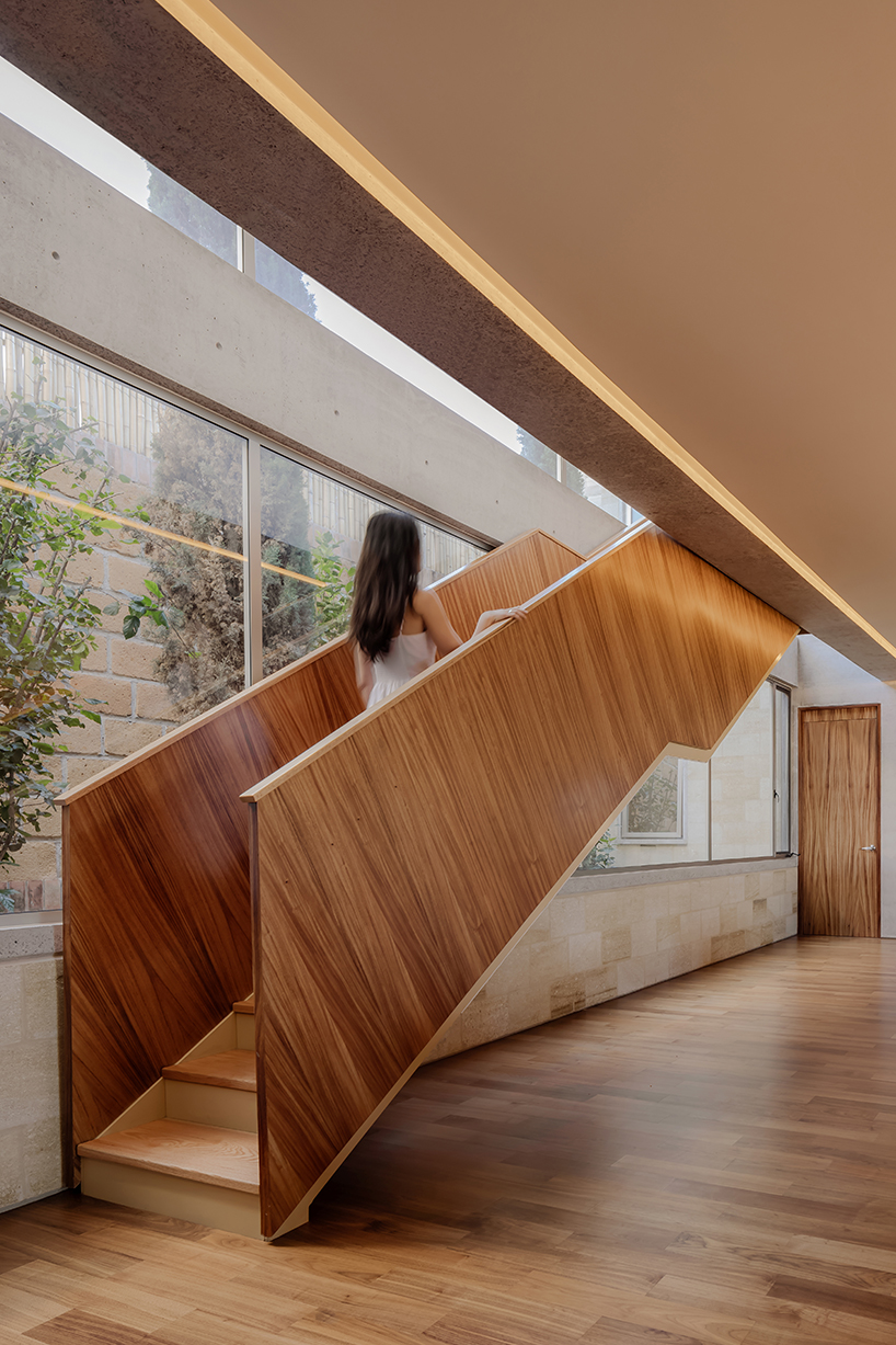 shielded portico encircles residence's square volumes in mexico