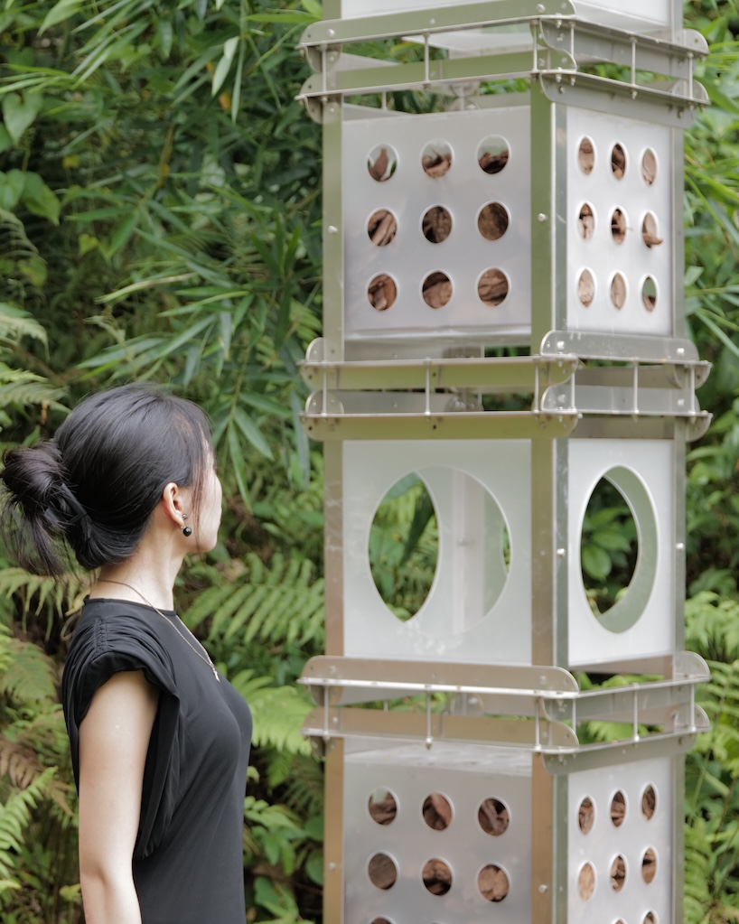 industrial modules and organic soil build architectural installation that grows with the forest