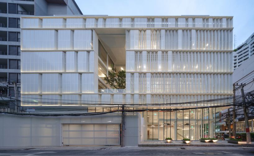 zigzag curtain wall enfolds silom residence's living units in bangkok