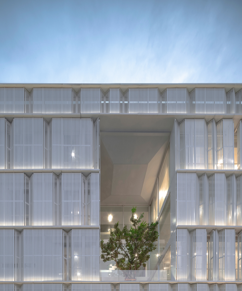 zigzag curtain wall enfolds silom residence's living units in bangkok