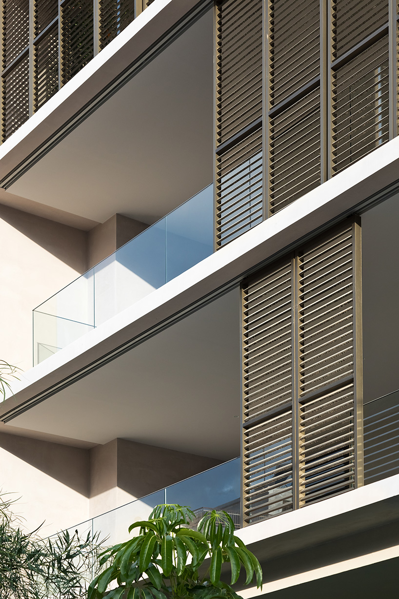 glass panes interlock between concrete slabs residential development in athens' suburbs