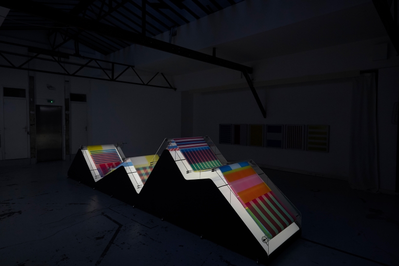 cyan magenta yellow installation by undo-redo nods to scottish tartan and bruno munari's unreadable books