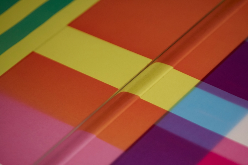 cyan magenta yellow installation by undo-redo nods to scottish tartan and bruno munari's unreadable books