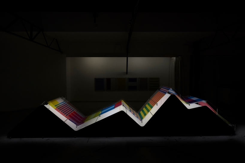 cyan magenta yellow installation by undo-redo nods to scottish tartan and bruno munari's unreadable books