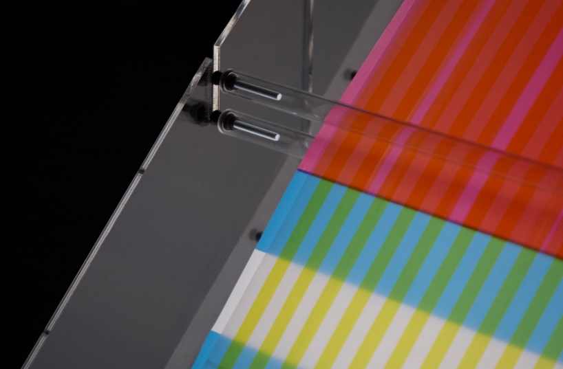 cyan magenta yellow installation by undo-redo nods to scottish tartan and bruno munari's unreadable books