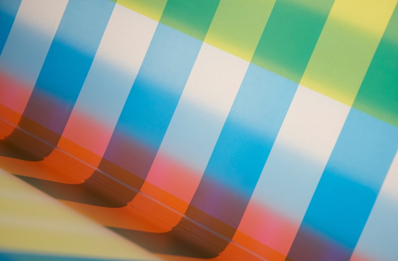 cyan magenta yellow installation by undo-redo nods to scottish tartan and bruno munari's unreadable books