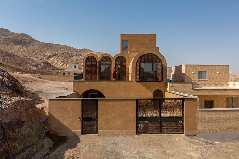 curved roofs root hypertext architecture studio's adobe house amid mountains of iran