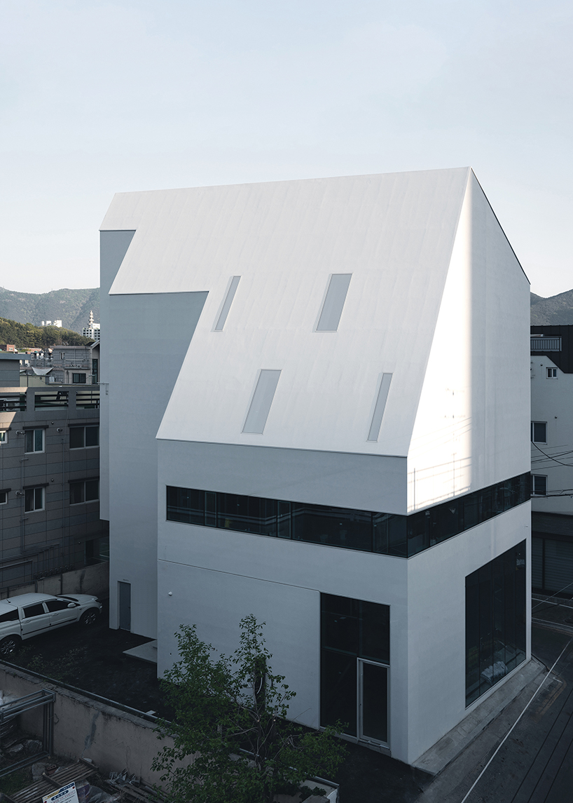 09A's white gabled house shifts perceptions of the familiar in south korean neighborhood