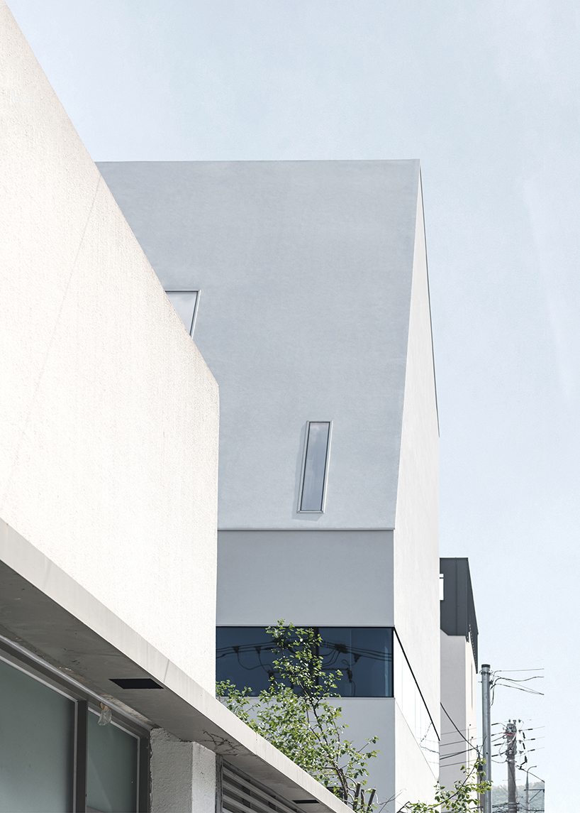 09A's white gabled house shifts perceptions of the familiar in south korean neighborhood