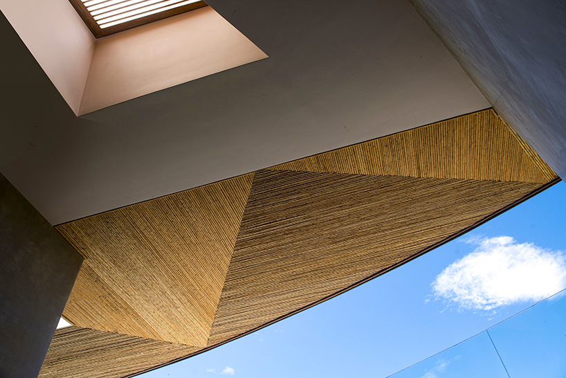 ansui house nosara by modus operandi aligns with its curvilinear site in costa rica