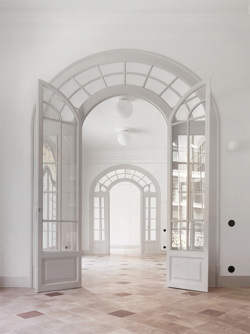 organic geometries restore fluidity into renovated office space in barcelona's historic building
