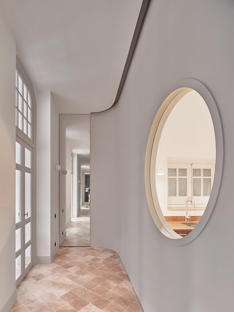 organic geometries restore fluidity into renovated office space in barcelona's historic building