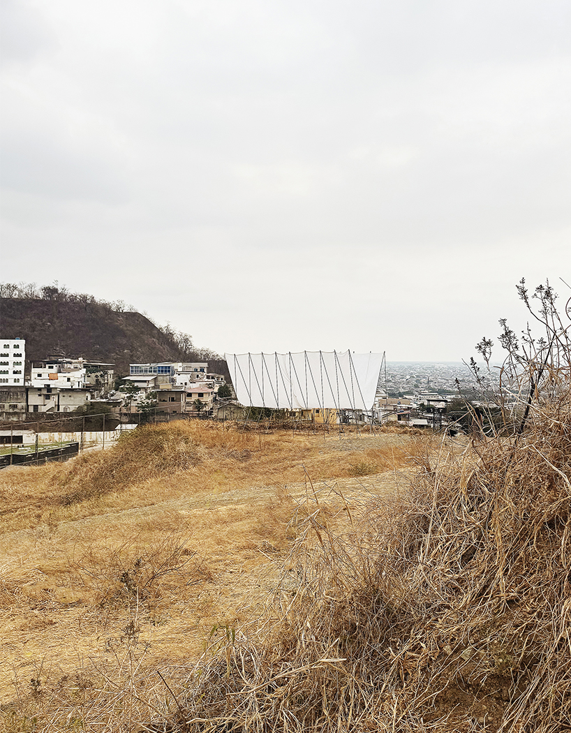 translucent fabric binds horizon pavilion's arrayed metal frame atop of ecuador hillside