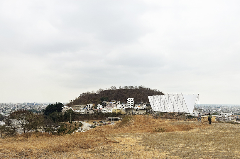 translucent fabric binds horizon pavilion's arrayed metal frame atop of ecuador hillside