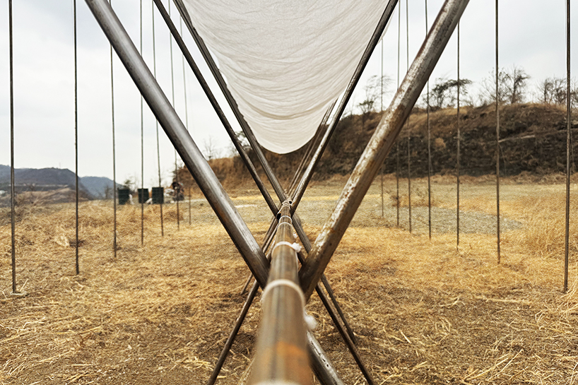translucent fabric binds horizon pavilion's arrayed metal frame atop of ecuador hillside