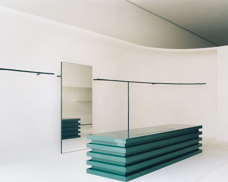 jil sander hamburg store's sculptural display elements shape hybrid boutique interiors
