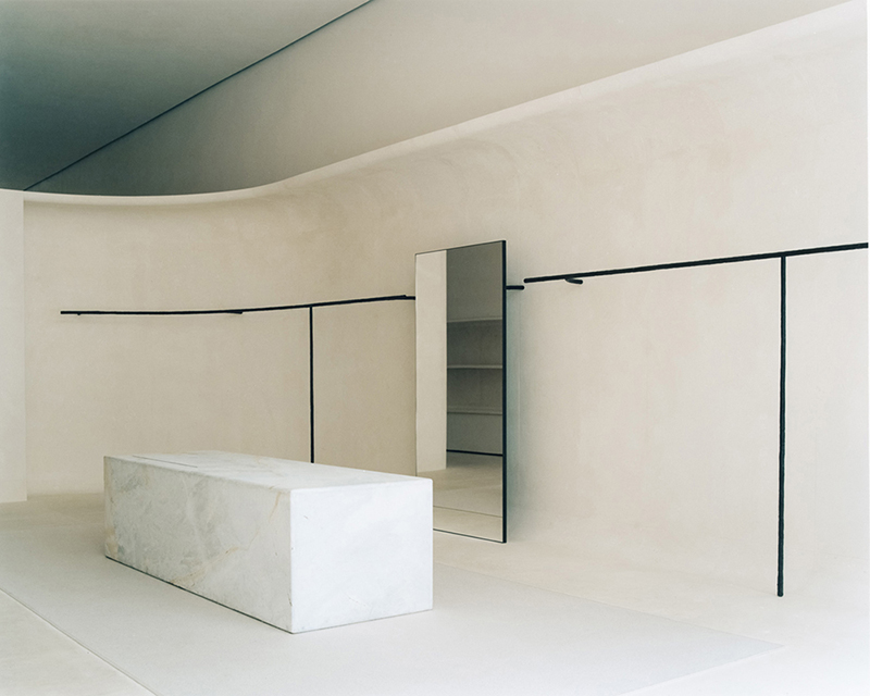 jil sander hamburg store's sculptural display elements shape hybrid boutique interiors