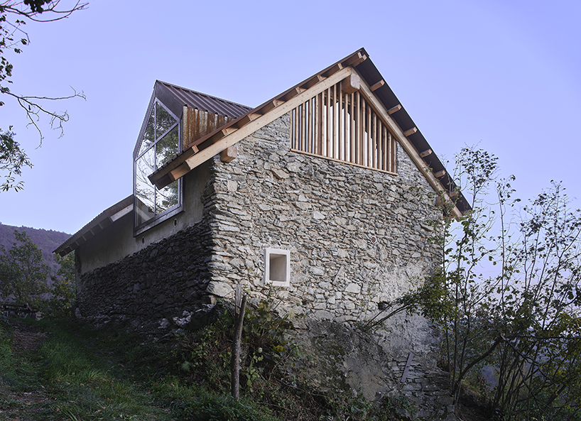 officina82 employs wood and stone to renovate abandoned rye barn in the italian alps