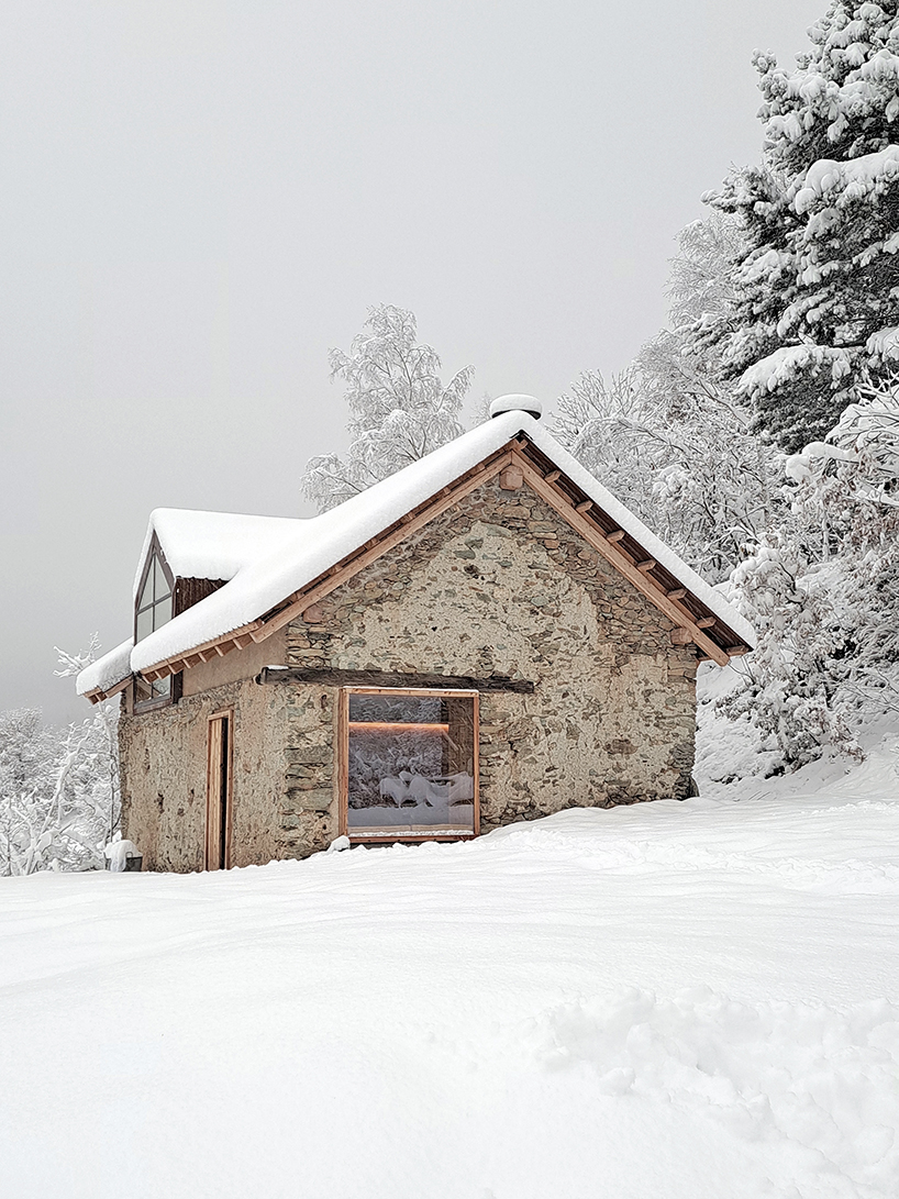 officina82 employs wood and stone to renovate abandoned rye barn in the italian alps