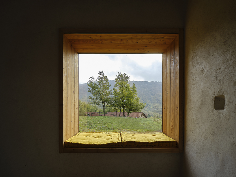 officina82 employs wood and stone to renovate abandoned rye barn in the italian alps