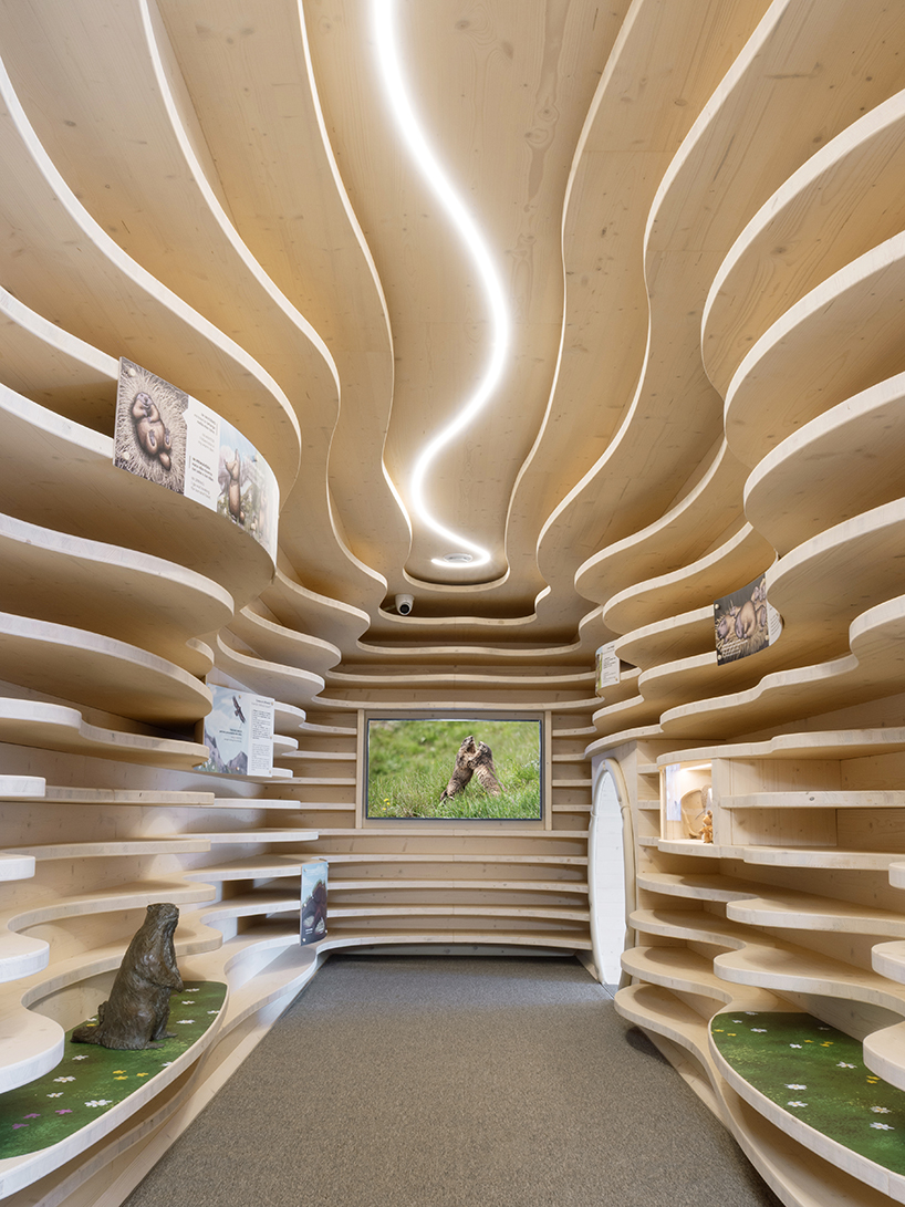 corten steel tubes lined with spruce plywood ribs form alpine learning burrow by officina 82 - 4