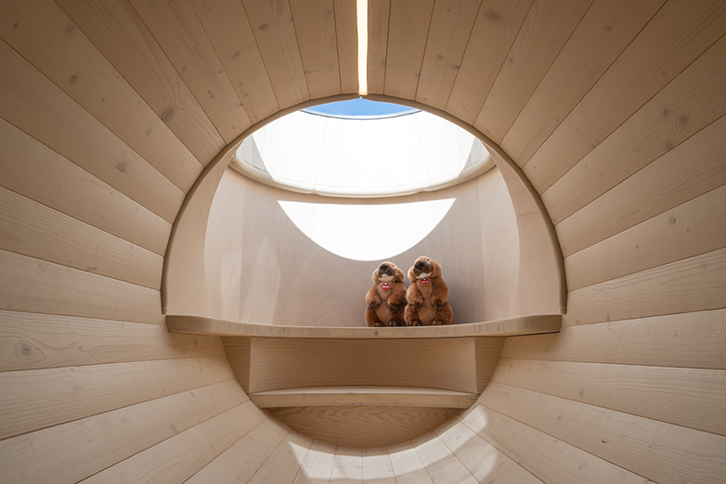corten steel tubes lined with spruce plywood ribs form alpine learning burrow by officina 82 - 5