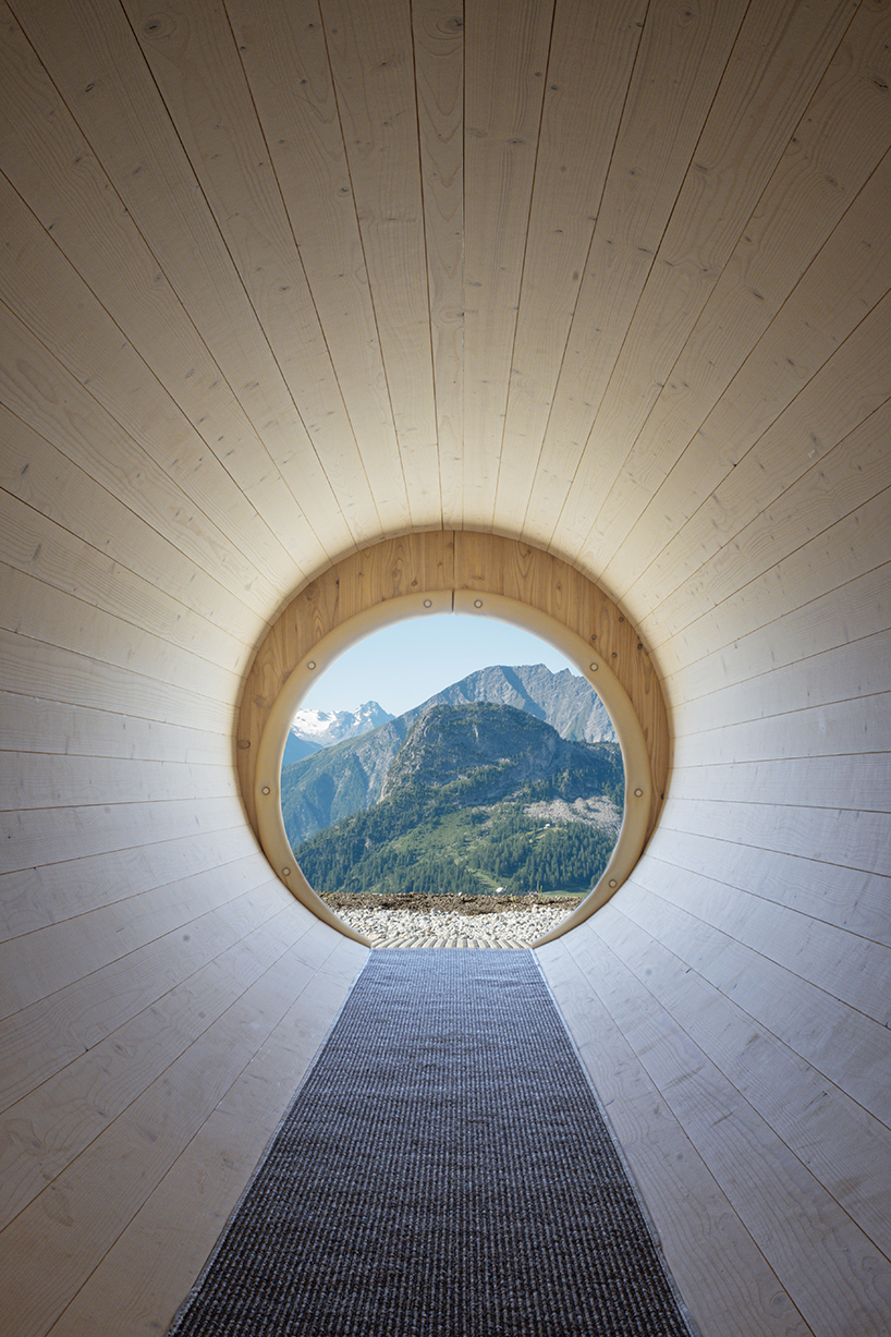 corten steel tubes lined with spruce plywood ribs form alpine learning burrow by officina 82 - 7