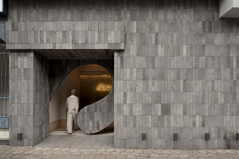 granite and fabric shape an interplay of solidity and fluidity at roca pilates studio in mexico