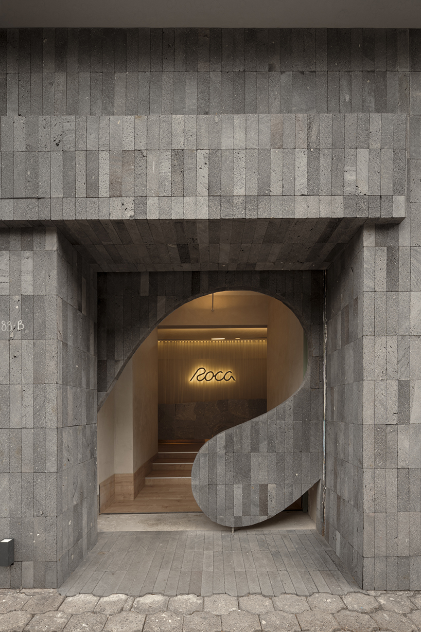granite and fabric shape an interplay of solidity and fluidity at roca pilates studio in mexico