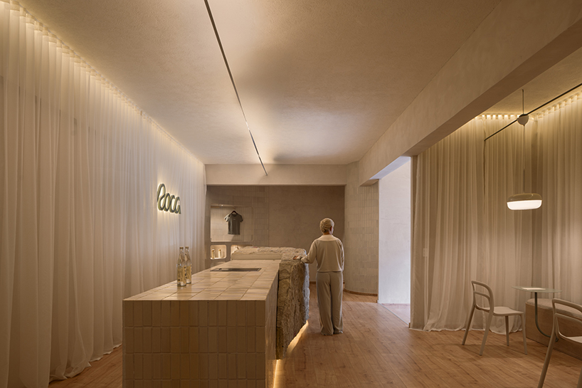 granite and fabric shape an interplay of solidity and fluidity at roca pilates studio in mexico