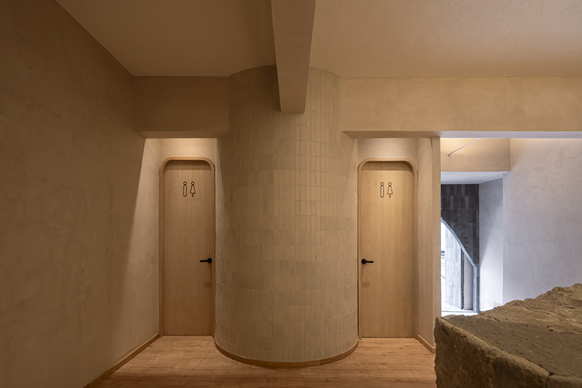 granite and fabric shape an interplay of solidity and fluidity at roca pilates studio in mexico