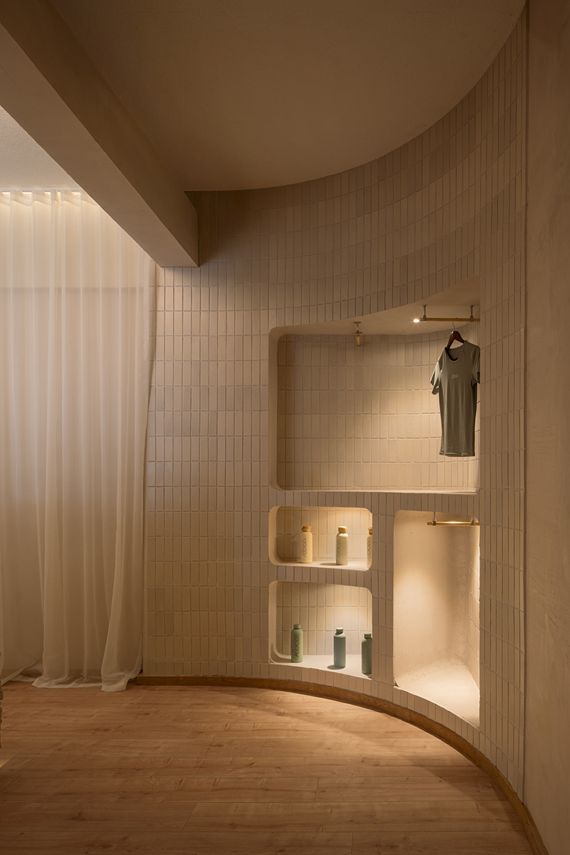 granite and fabric shape an interplay of solidity and fluidity at roca pilates studio in mexico