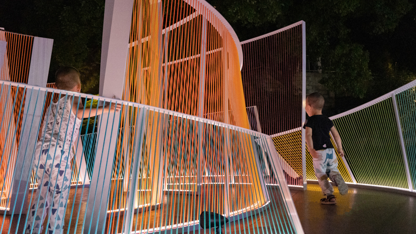 overlapping nylon ropes shape colorful curved contours for mirage installation in shanghai