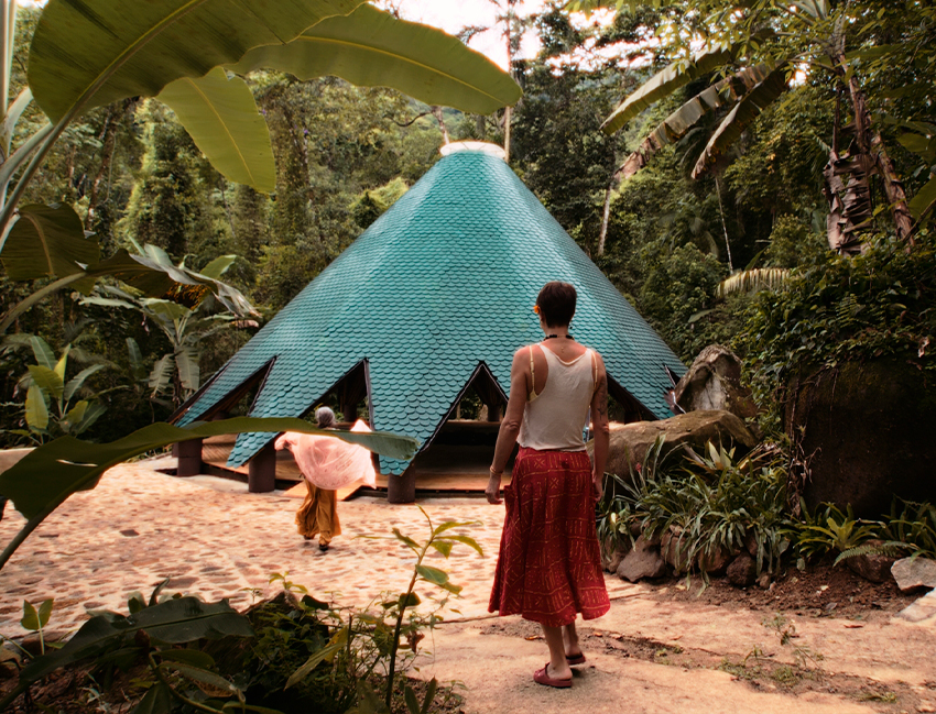 ceramic tiles in blue and green hues cover tapered ayuru forest temple in brazil