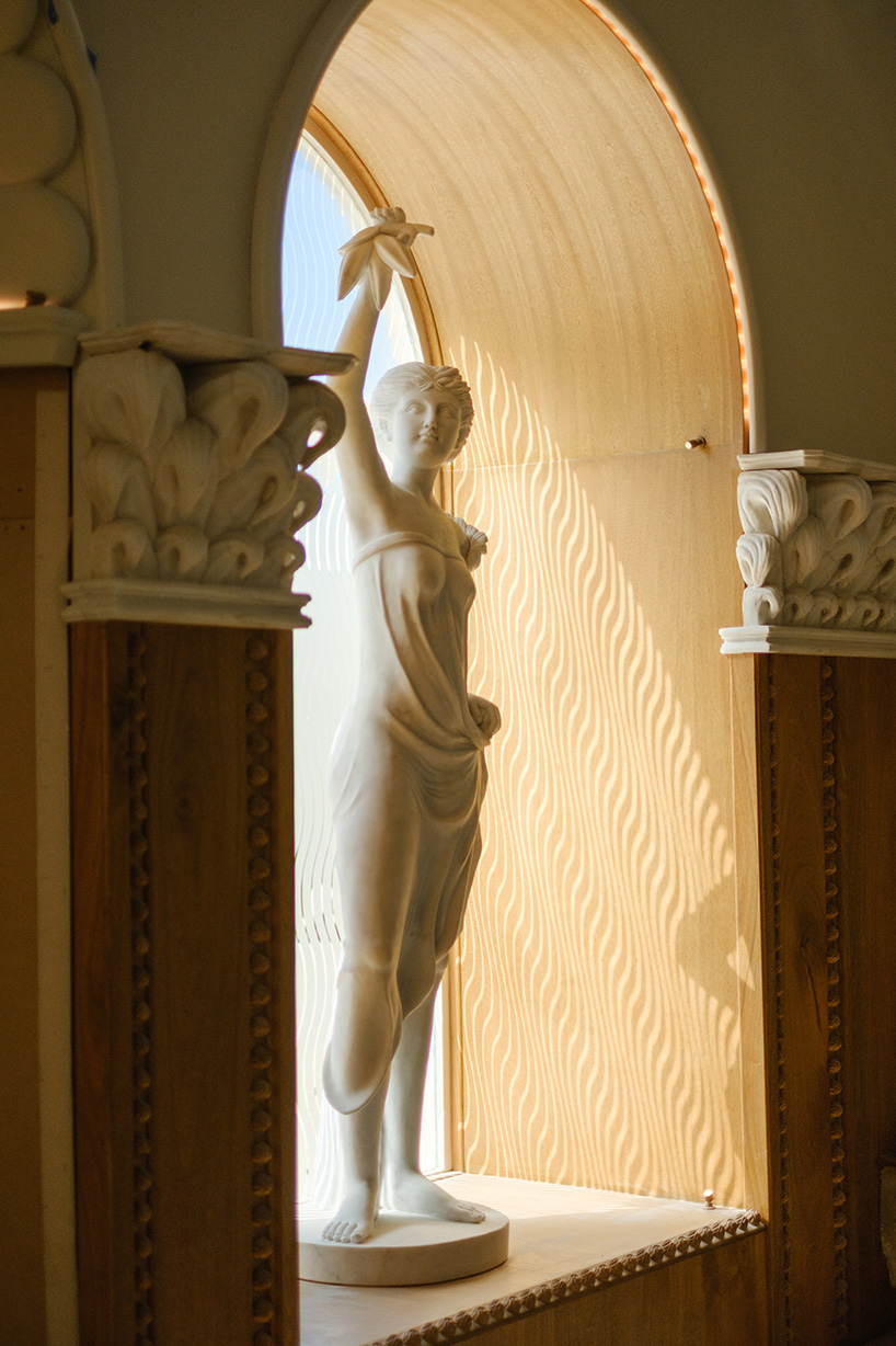 dessert-shaped sculptures in marble and wood ornament ice cream shop in argentina