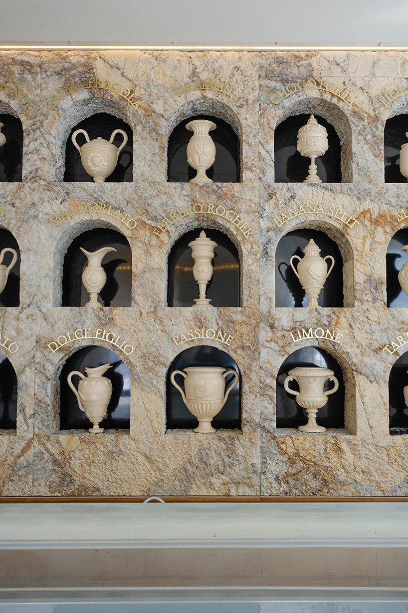 dessert-shaped sculptures in marble and wood ornament ice cream shop in argentina