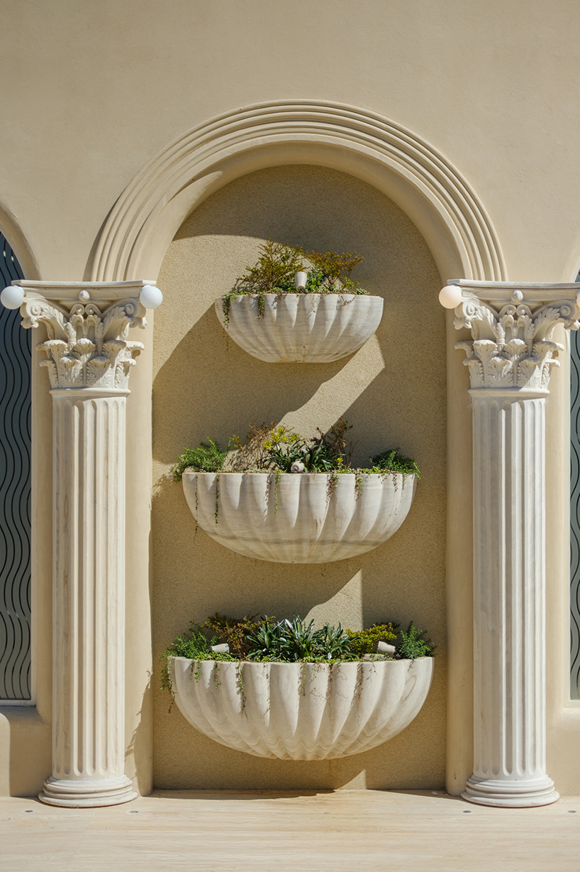 dessert-shaped sculptures in marble and wood ornament ice cream shop in argentina