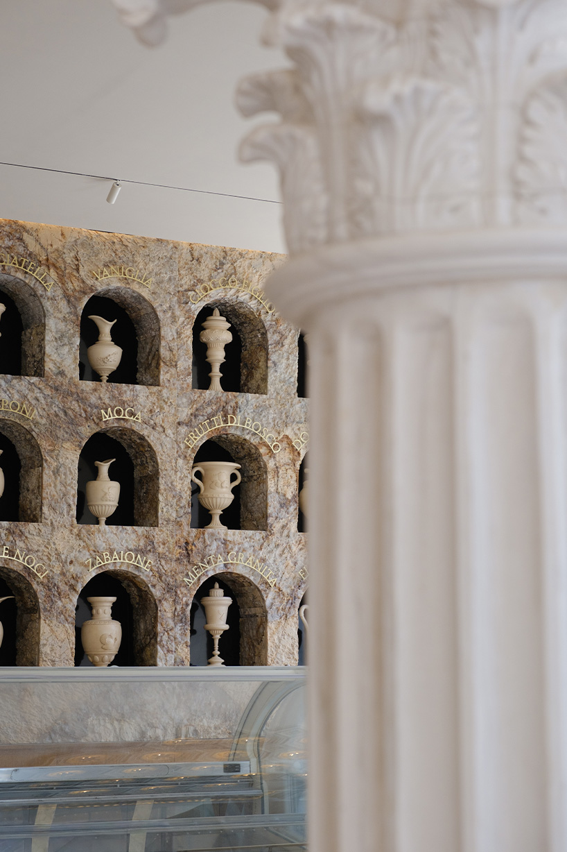 dessert-shaped sculptures in marble and wood ornament ice cream shop in argentina