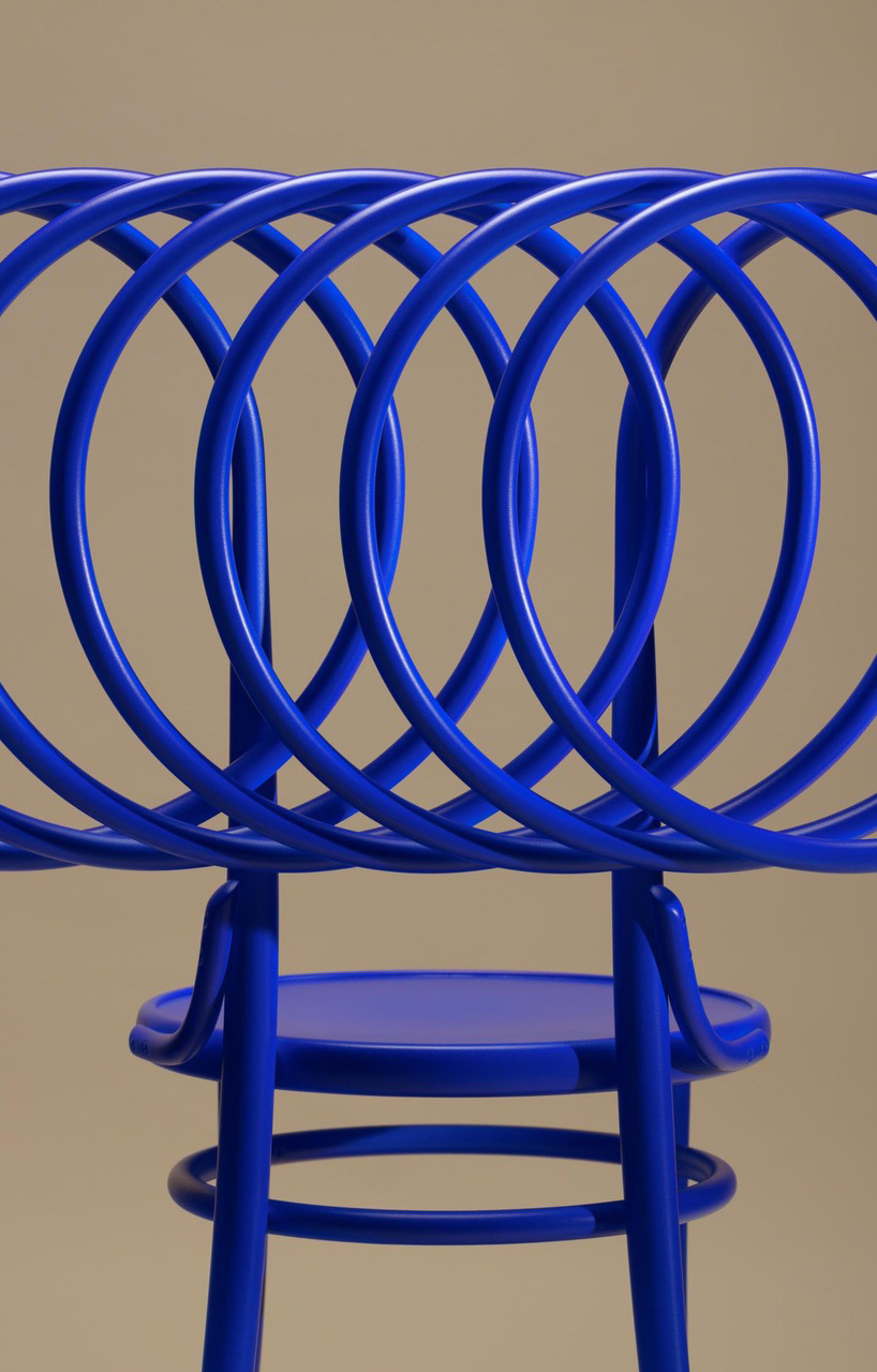bent wooden circles revise ton’s iconic chair 14 displayed at milan design week 2024