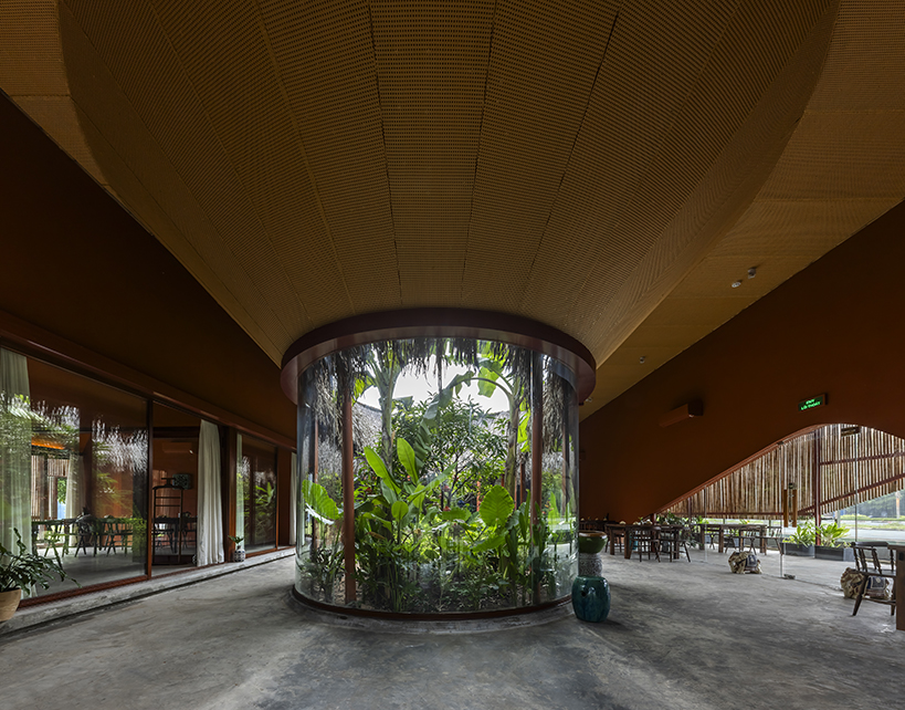bamboo skin shades over nhà tú garden restaurant's outer dining space in vietnam