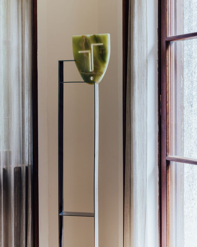 berenice curt sculpts androgynous faces into reclaimed marble at milan design week