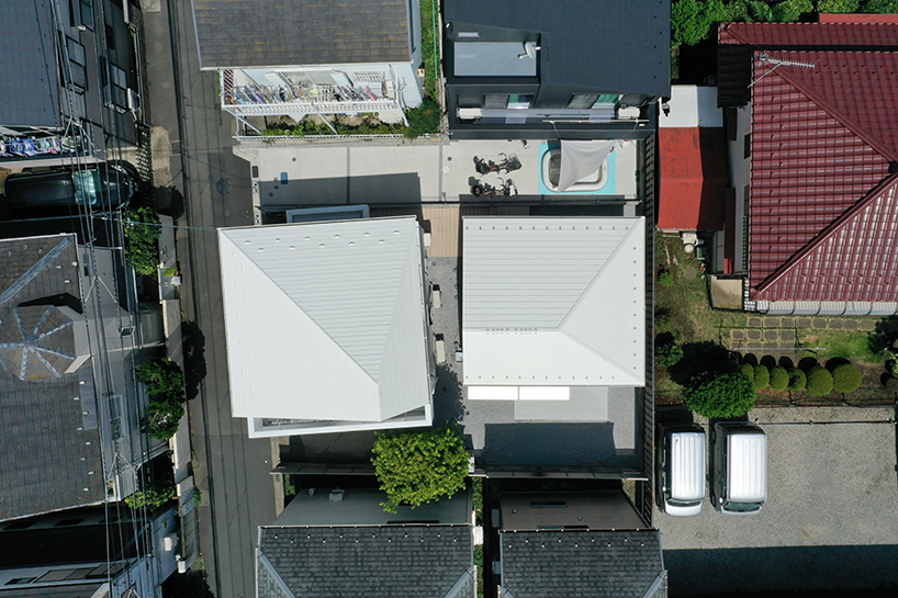shifted roofs and reflected light connect old and new homes in suburban tokyo - 1