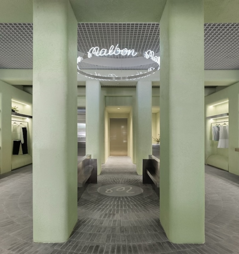 light green textured stucco walls envelop malbon miami golf boutique by 22RE