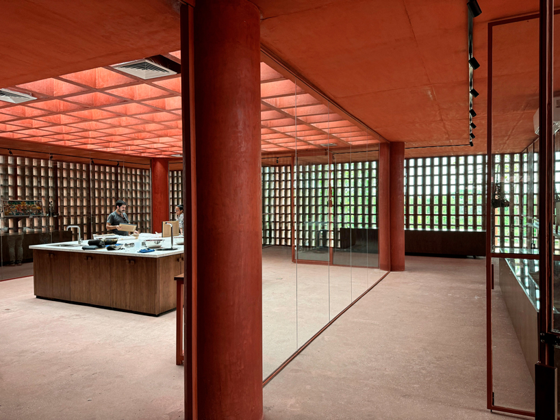 cast in red-pigmented concrete, la cacaotera museum celebrates cacao heritage in mexico - 9