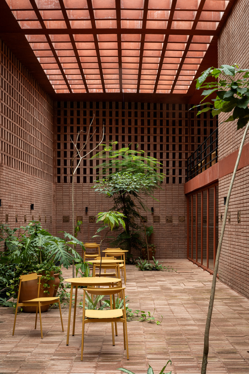 cast in red-pigmented concrete, la cacaotera museum celebrates cacao heritage in mexico - 6