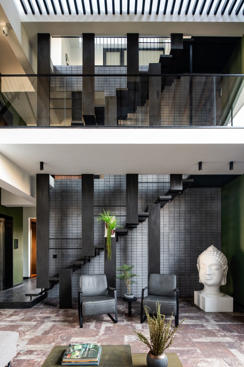 earthy textures and concrete planes define ashwin architects’ kodalli's residence in india