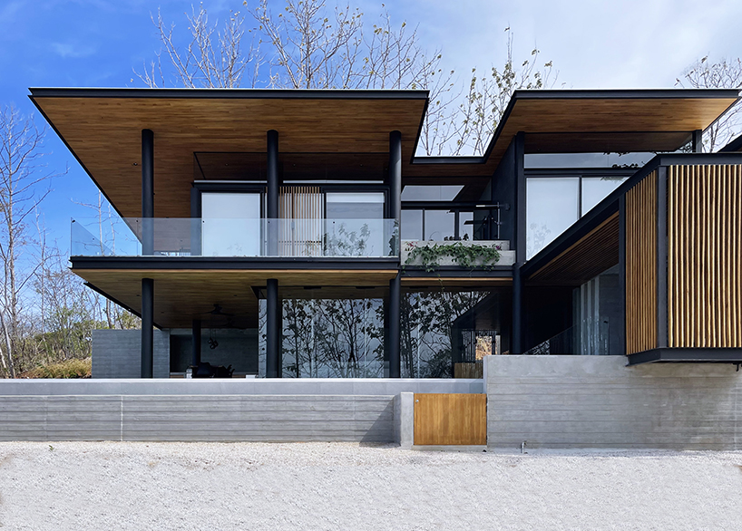 concrete residence's L-shaped infinity pool merges with costa rica's pacific coast